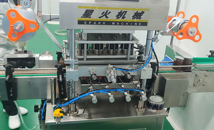塑料瓶自動(dòng)封膜機設備